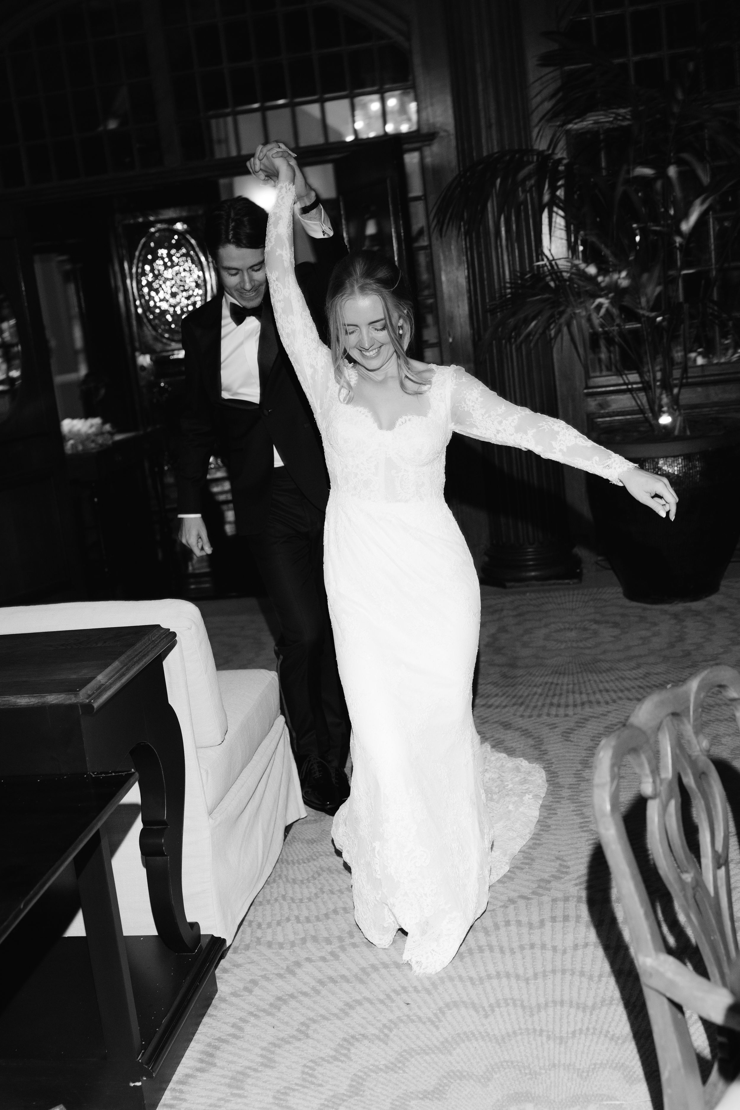 Black and white photos show a person in a white dress dancing and moving energetically on a patterned floor.