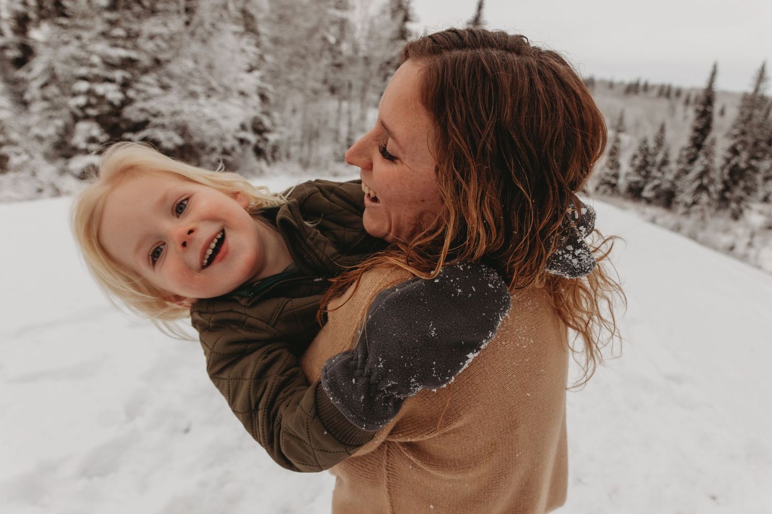 Joyful winter scene showing affectionate interaction in the snow.