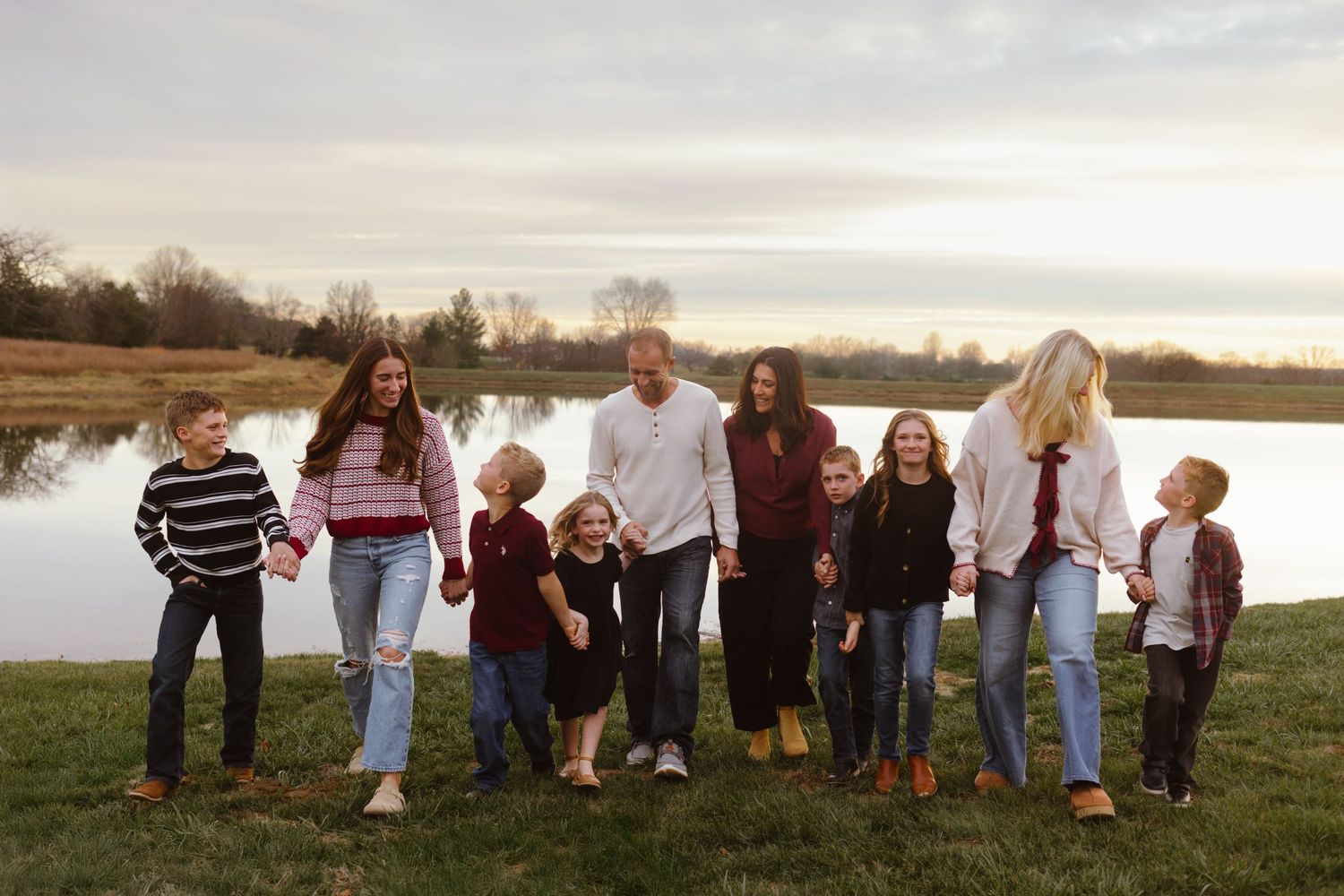 A series of candid outdoor family photos showing people walking together in casual clothing against natural backgrounds.