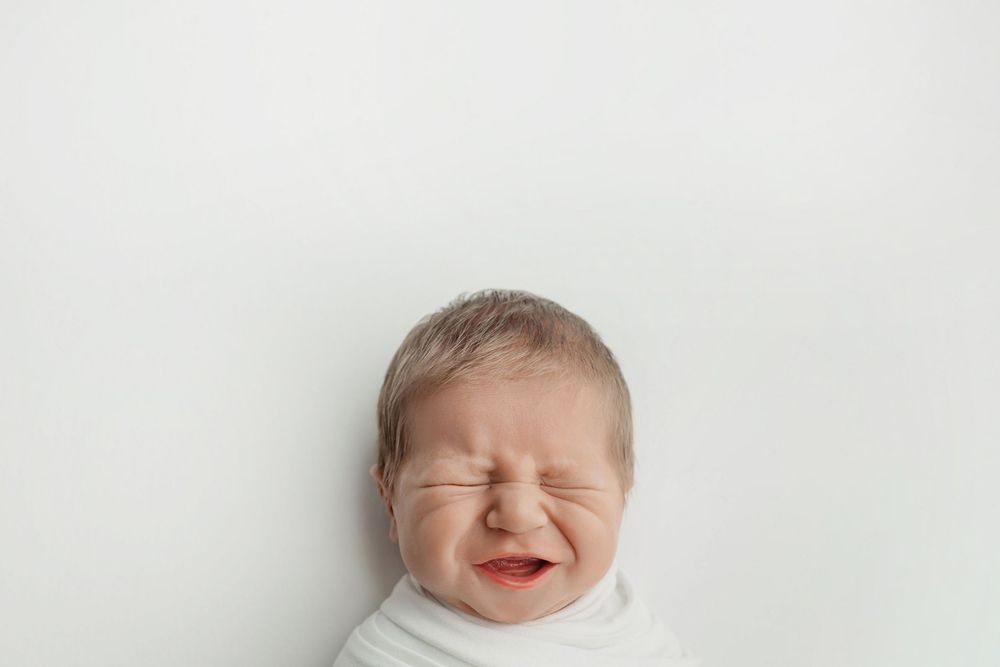 Newborn boy on white background, taken by Jen Knightstep, Photographer