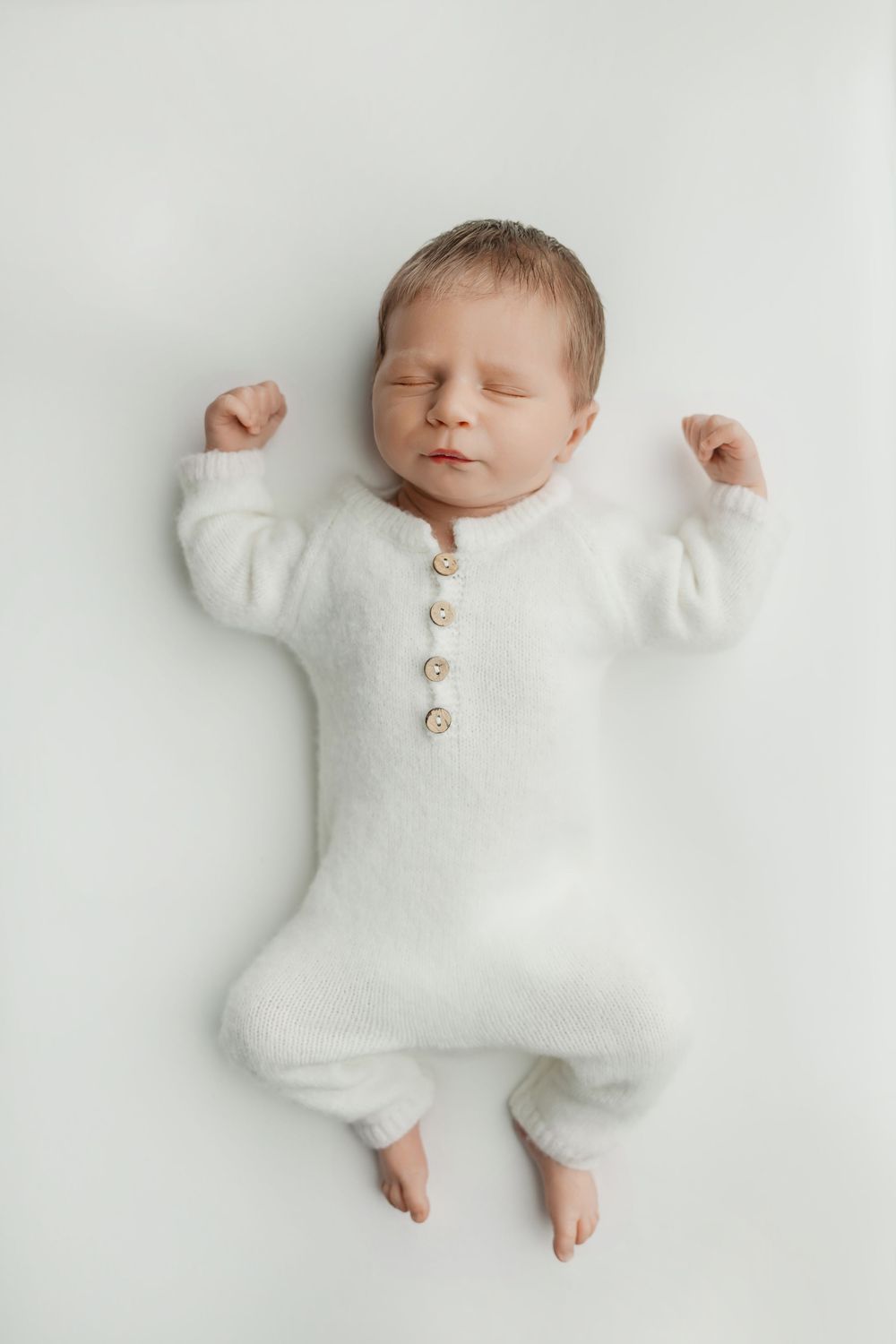 Newborn boy on white background, taken by Jen Knightstep, Photographer