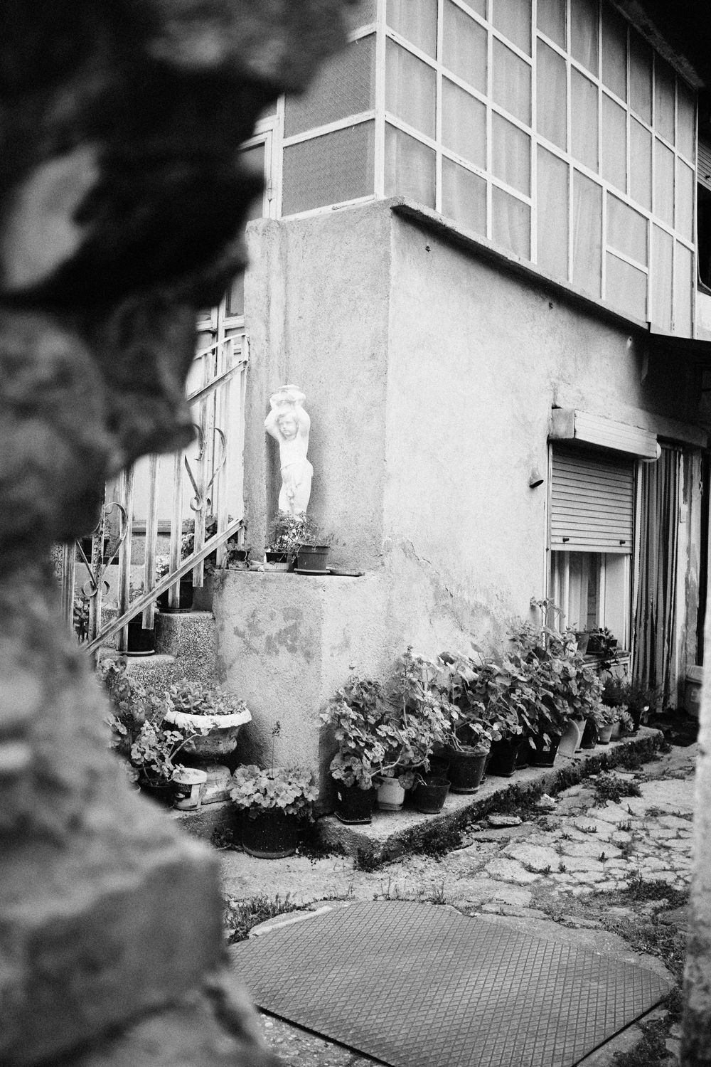 A view through the collapsed wall of a 50s house in Skopje, North Macedonia.