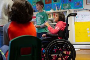 Inclusive classroom scene with students gathered for an educational activity.
