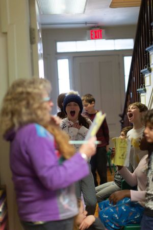 Animated classroom scene with students engaged in interactive learning activities.