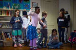 Children participating in an active learning session in a bright classroom space.