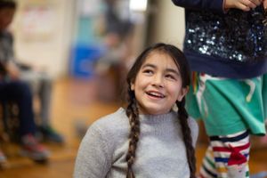 Students interacting during an engaging classroom activity.