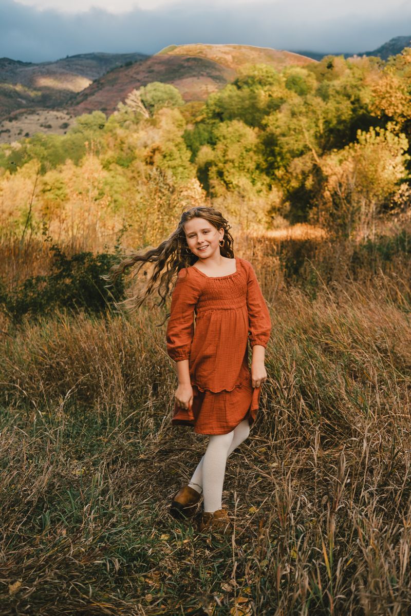 Fall family photos with Michelle Deppe Photography at Kay's creek parkway in Layton, Utah.