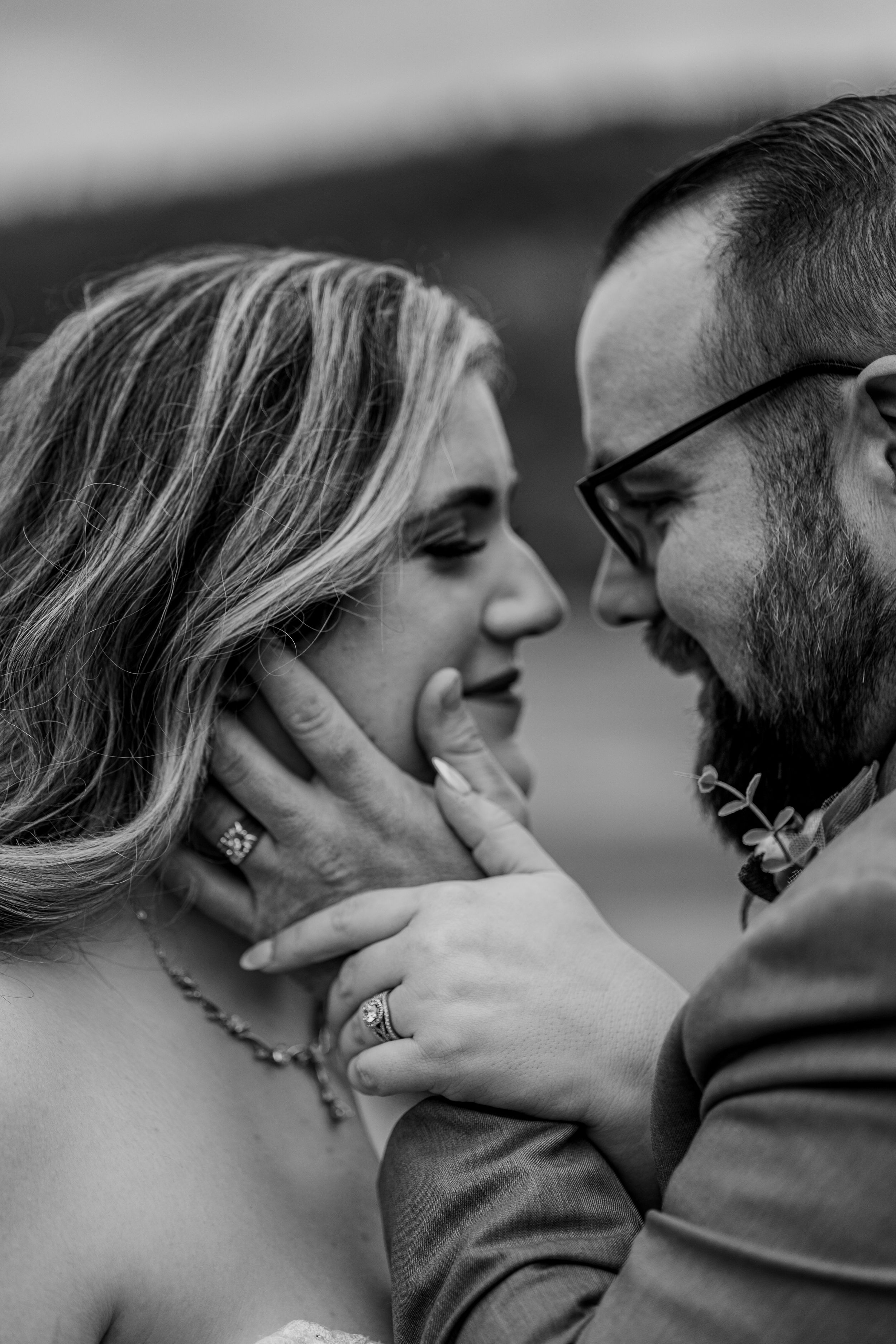 A romantic black and white photo series showing a couple sharing passionate kisses in close-up profile views.