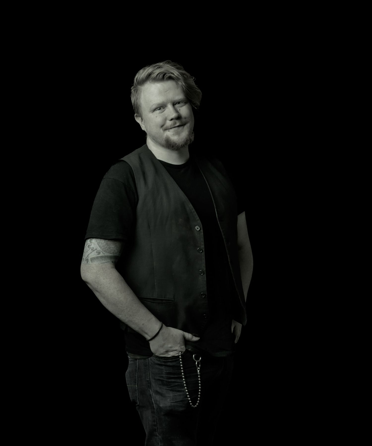 Portrait series against black background with dramatic lighting.