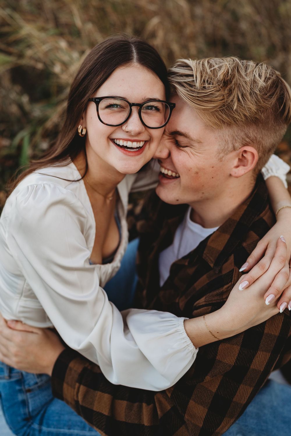 Close-up shots of a couple sharing tender moments during an autumn photoshoot.