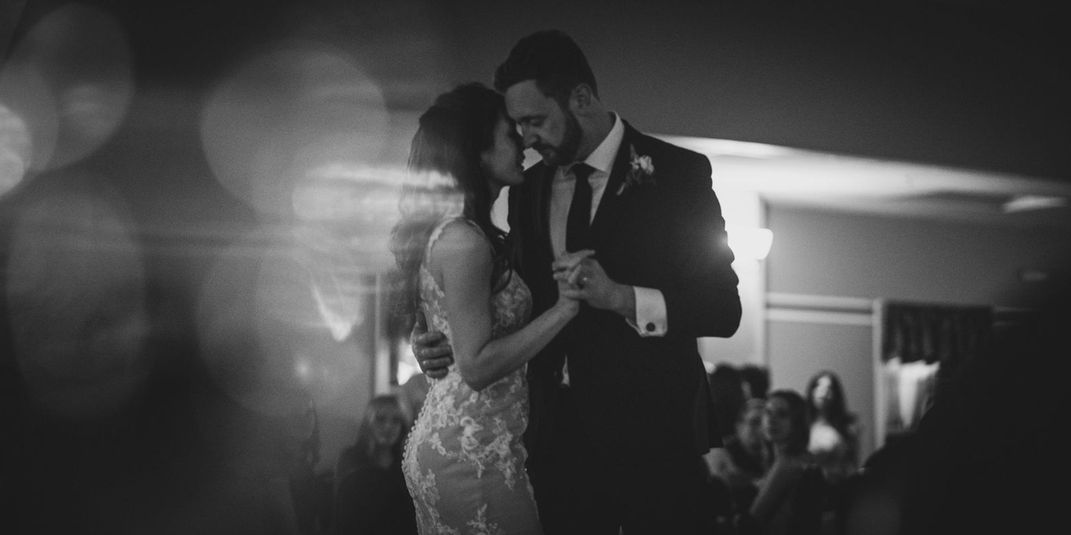 Cinematic dancing photo of bride and groom.