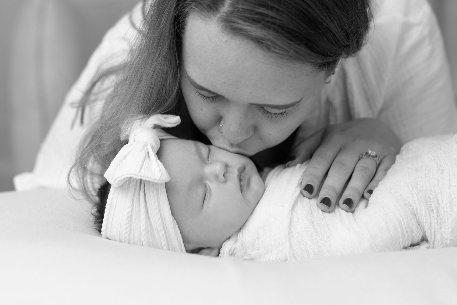 A collection of intimate black and white close-up photographs showing tender moments.