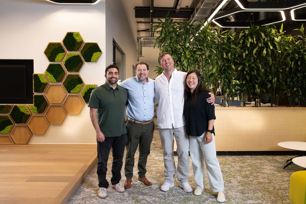 A series of connected images showing people in an office space with hexagonal wall decorations and modern furnishings.