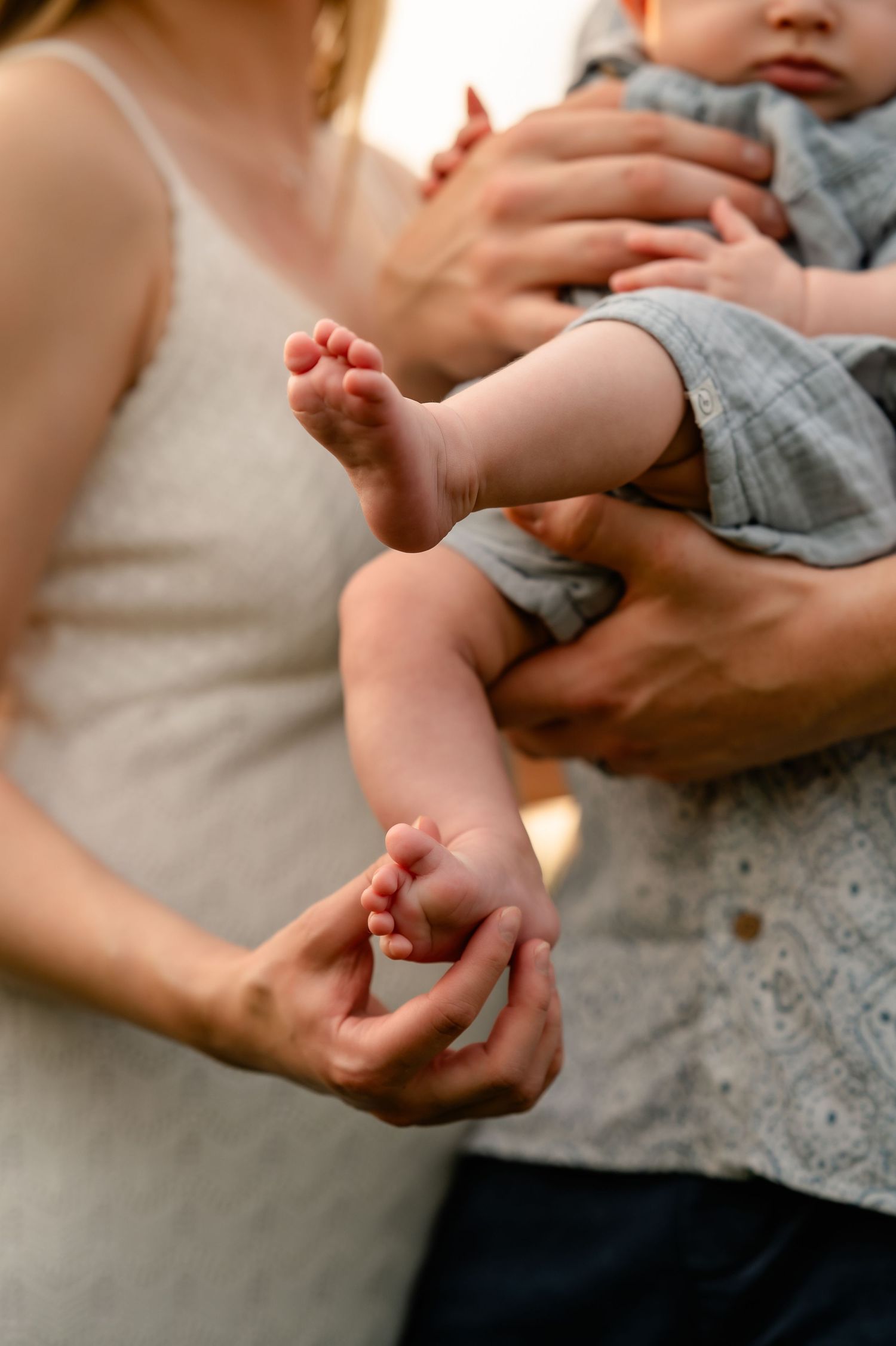 mom touching baby's feet created by Storms Photography Pennsylvania photographer