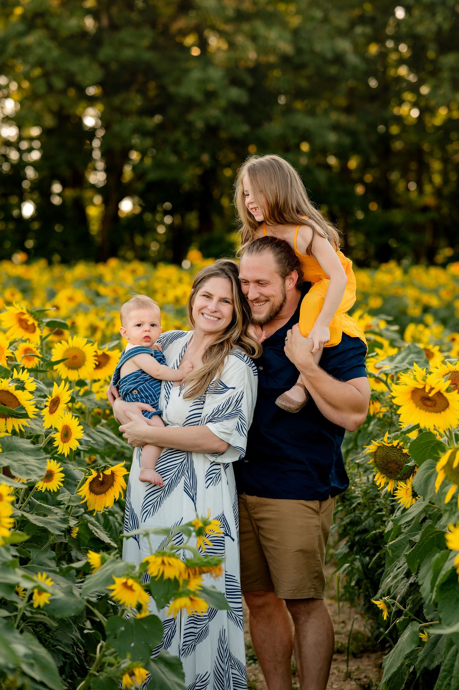 family in sunflower field created by Storms Photography Pennsylvania photographer