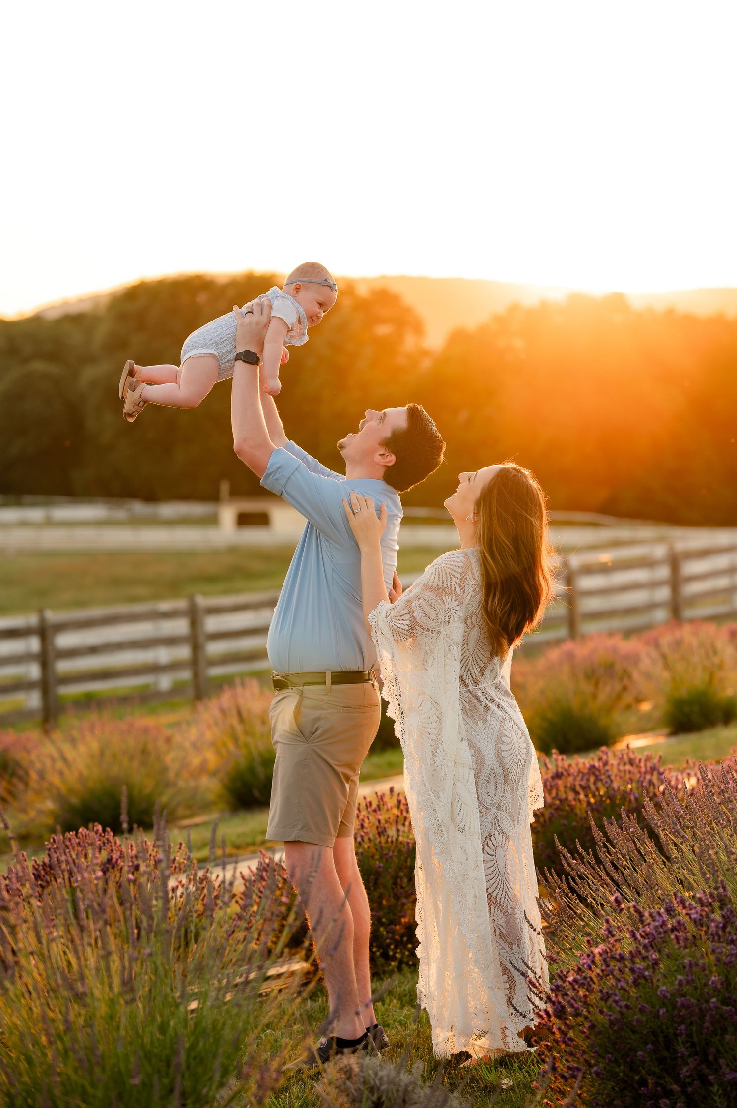dad lifting baby at lavender field created by Storms Photography Pennsylvania photographer