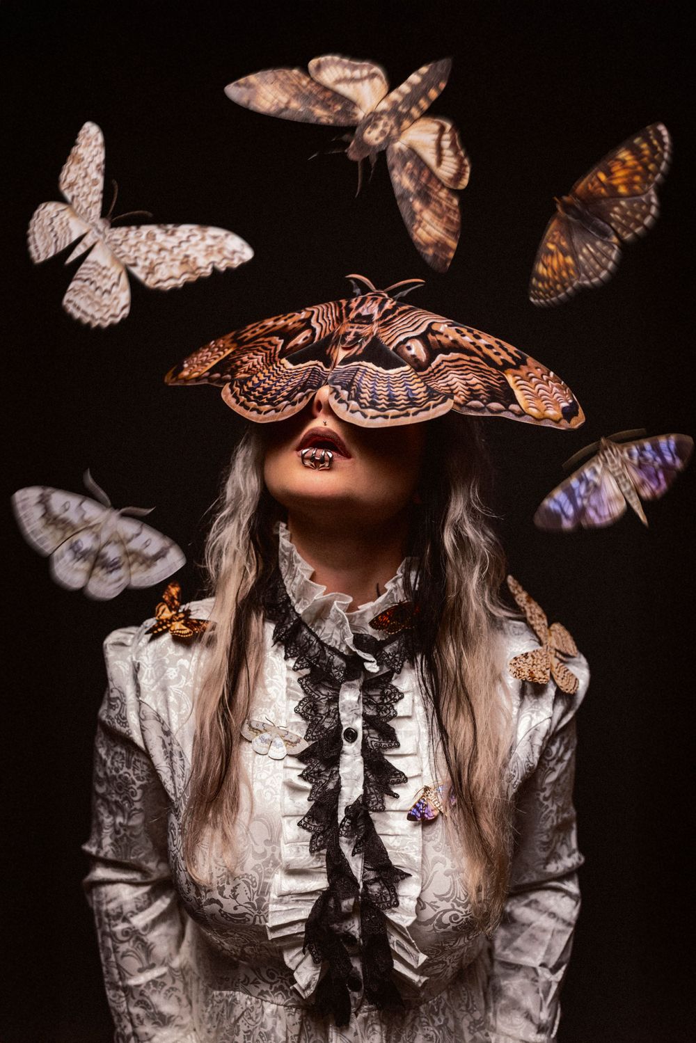 Artistic portrait with floating butterflies against dark background.