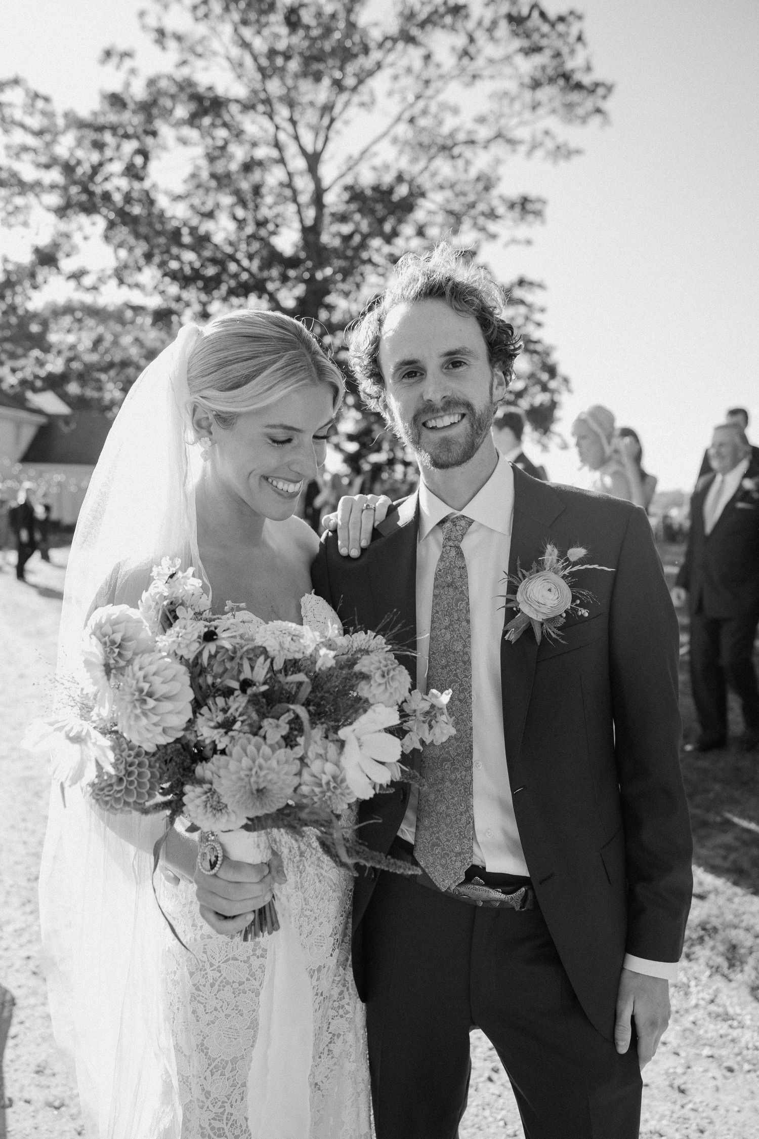 Black and white wedding portraits captured against natural outdoor backdrop.