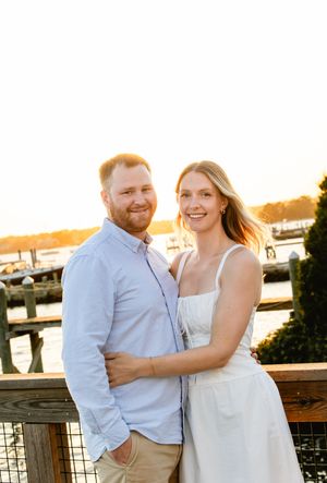 Casual engagement photos at sunset by waterfront dock. New England engagement photos.