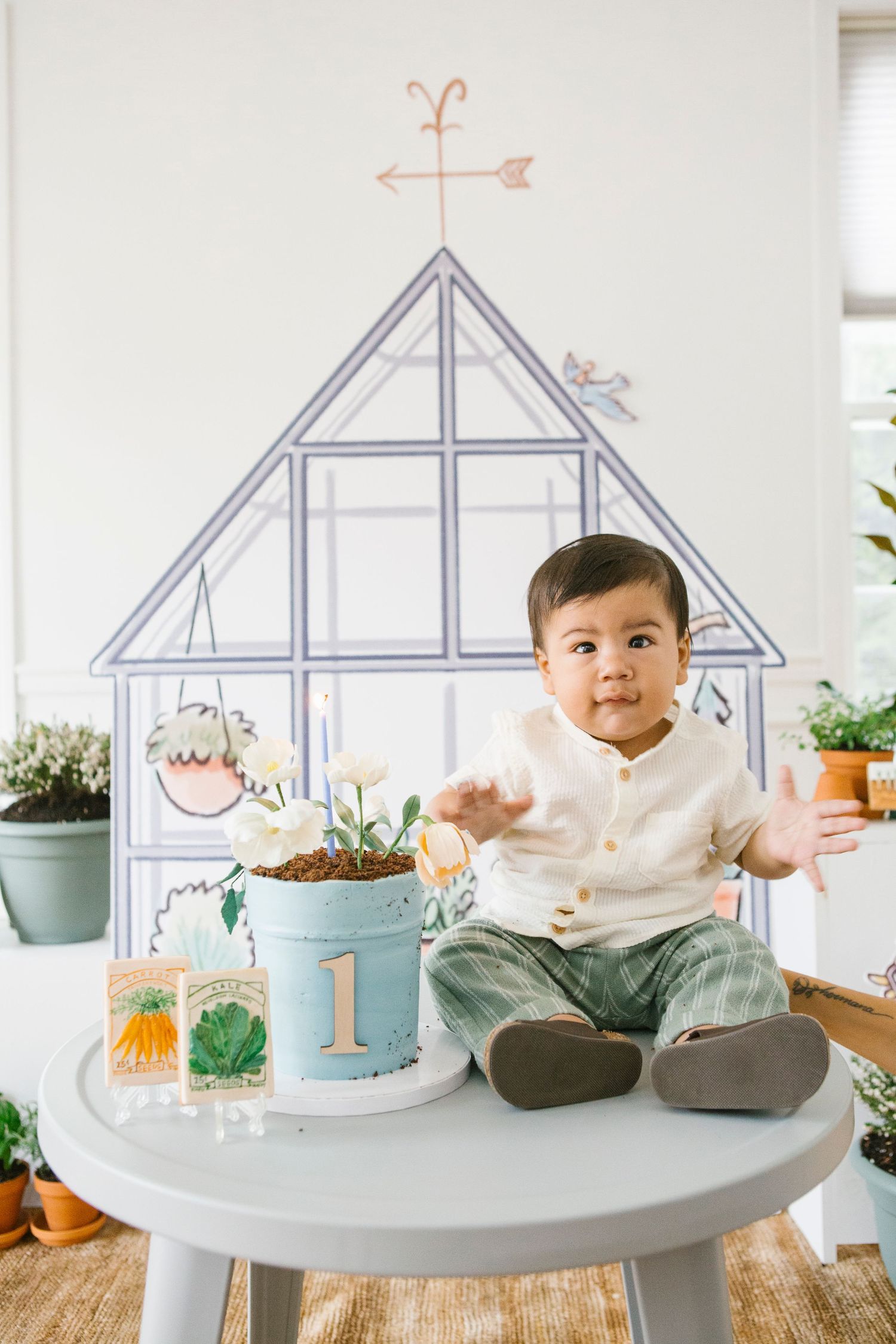 Birthday boy next to cake during Happy Birthday song, taken by NYC family photographer Paula Ortiz