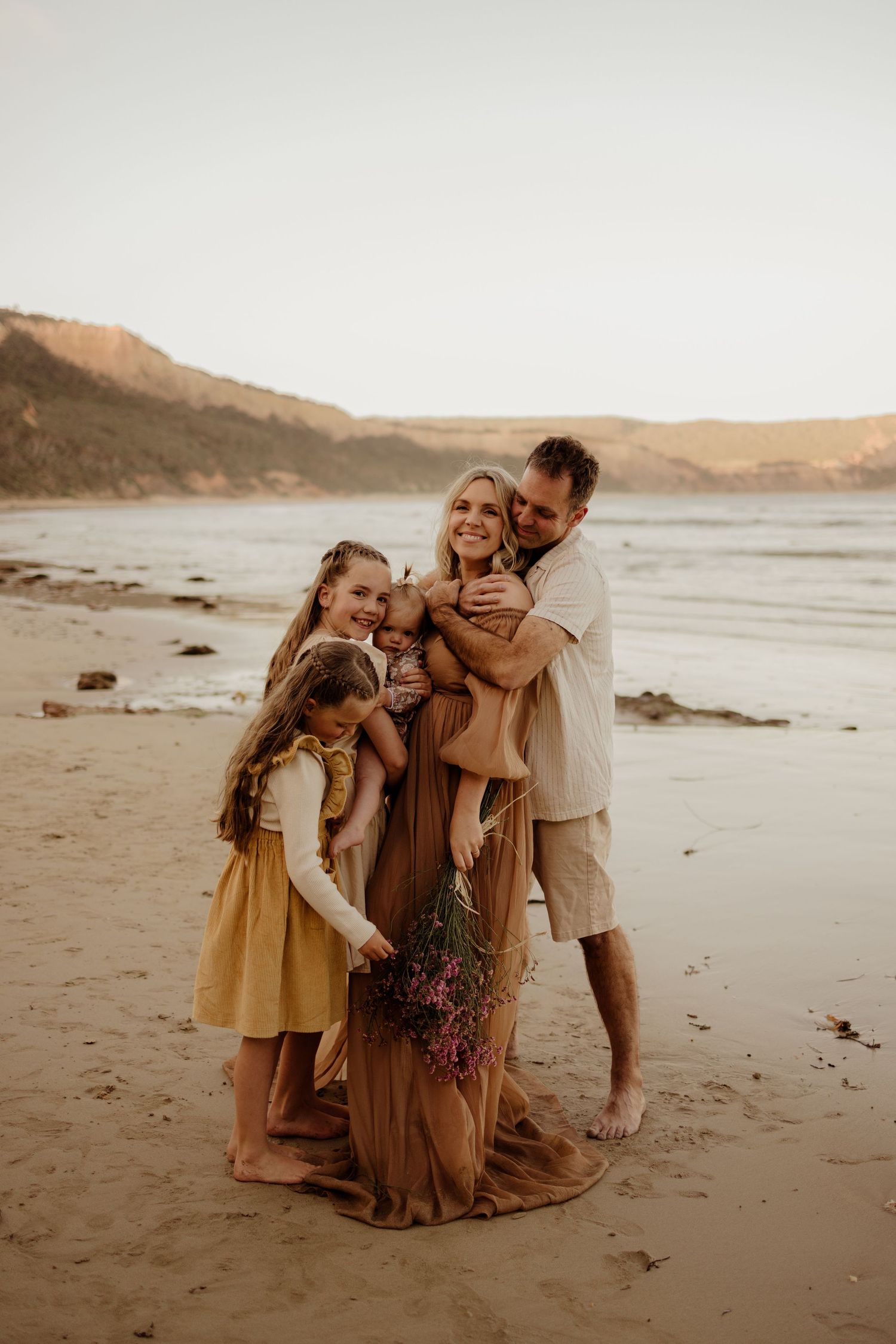 Portrait of Jessica Henderson Photography and her family on the beach