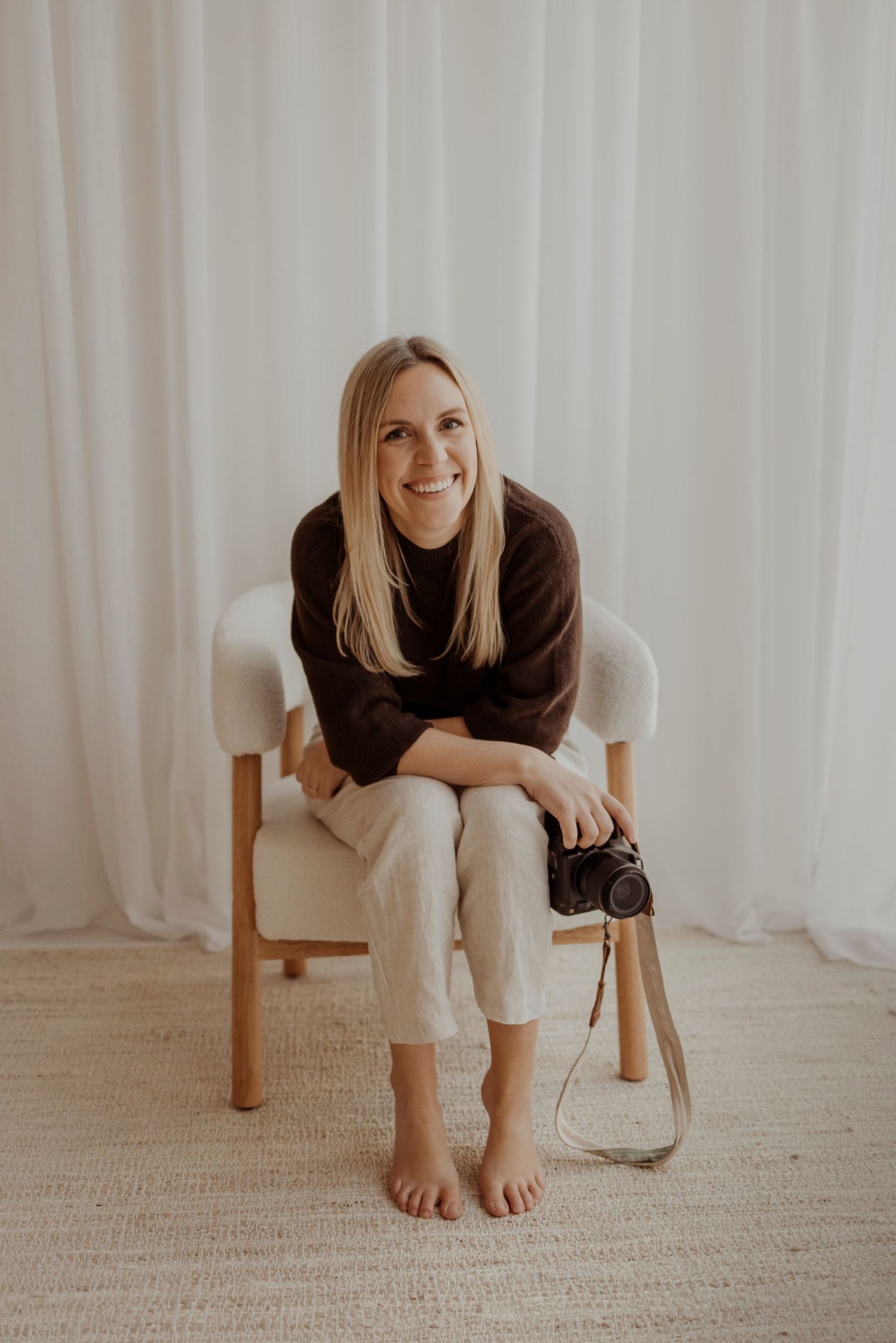 Portrait of Jessica Henderson Photography and her camera, branding photography for photographers