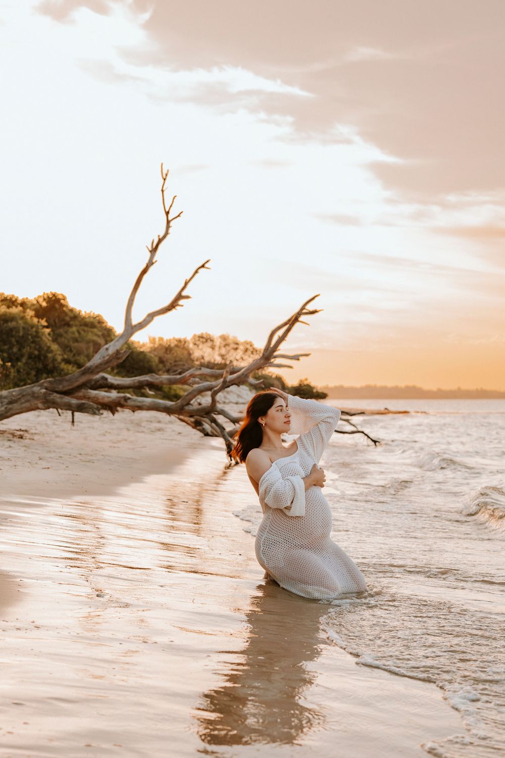 Pregnant Mum kneeling in the water