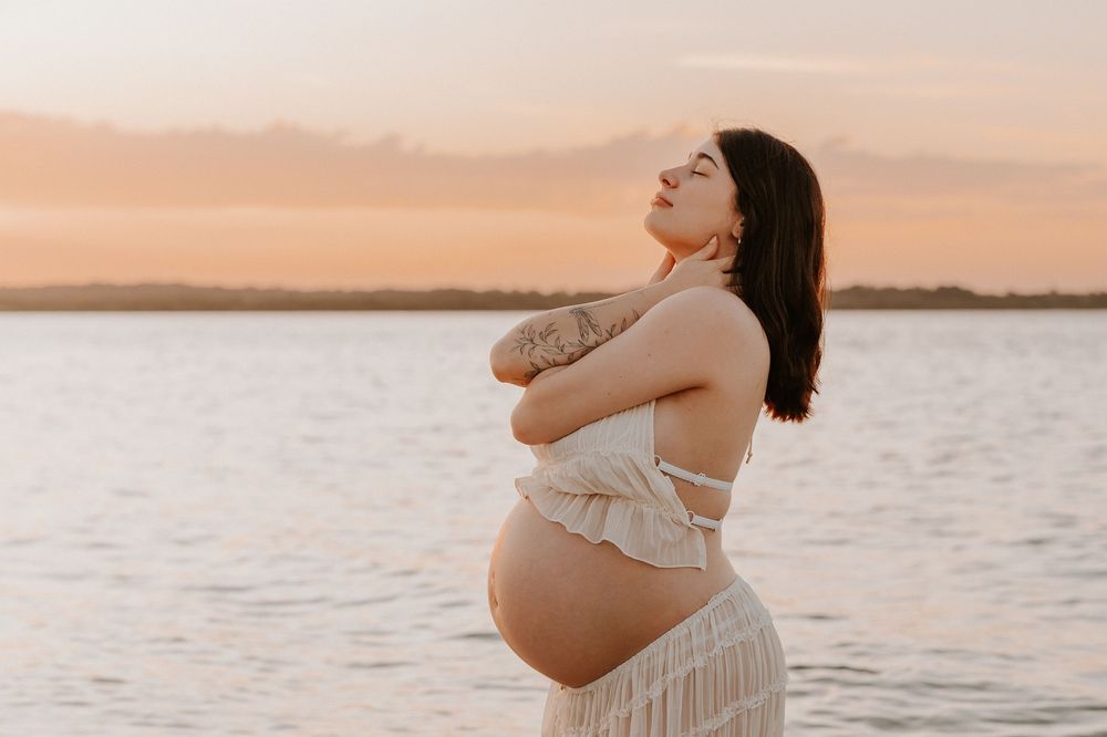 Pregnant Mumma embracing herself