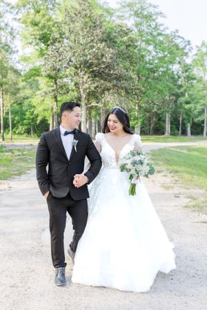 just married couple walking in the trail celebrating their wedding