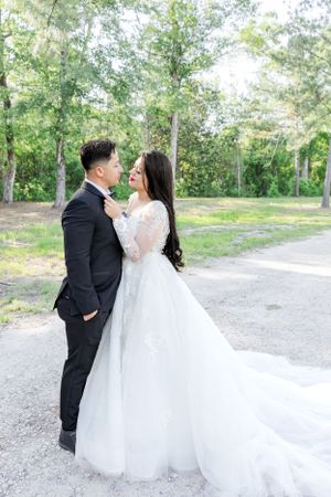 bride and groom holding each other romantically in their special day