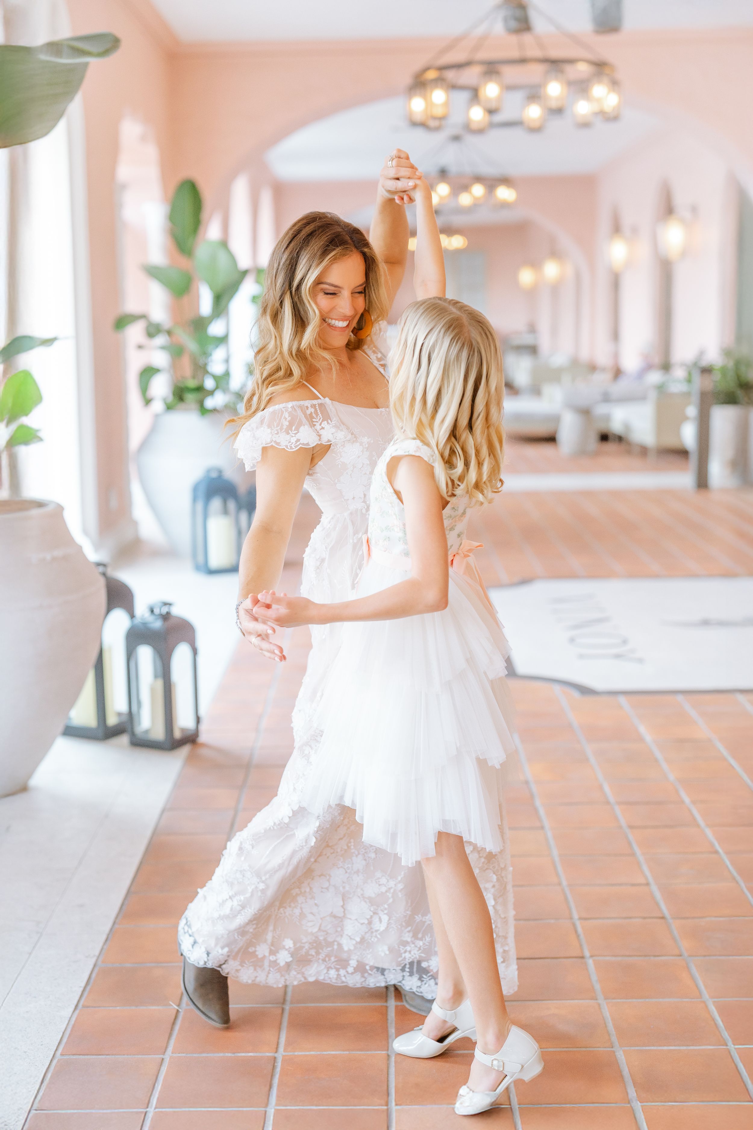 daughter dancing with her mom at The Vinoy in St. Pete, Florida during their family photoshoot