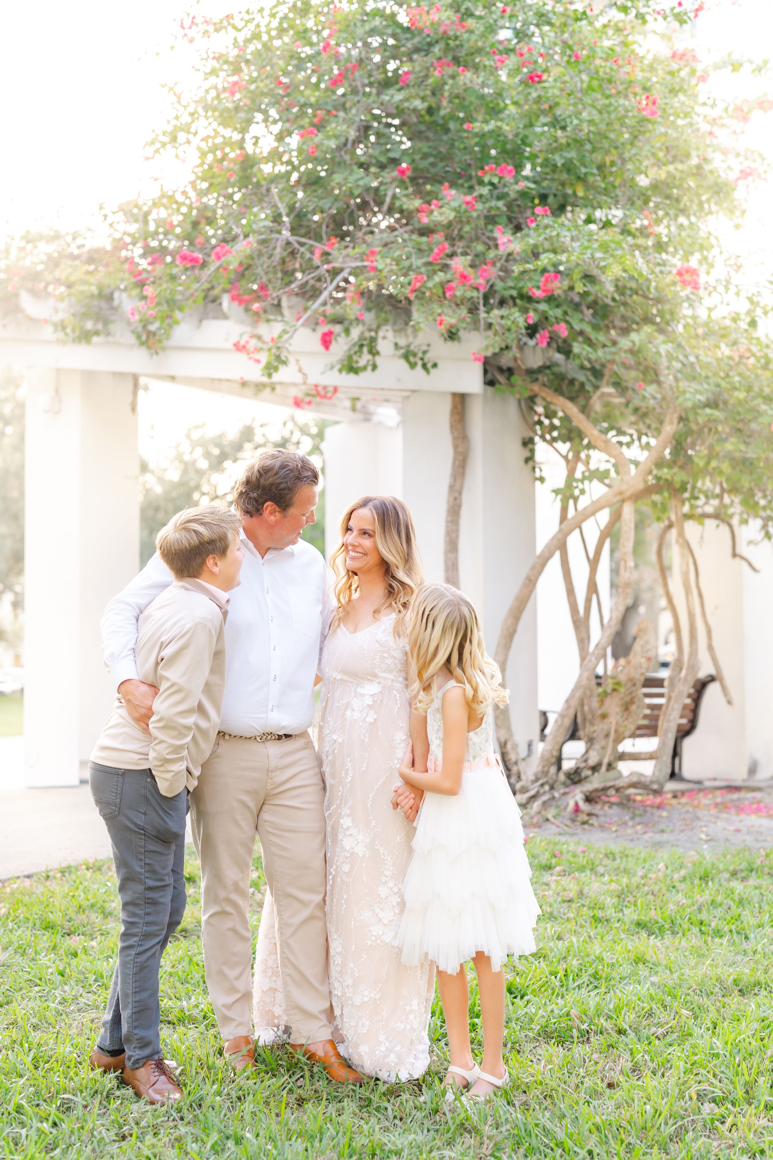 family holding hands cuddling today at The Vinoy in Downtown St. Pete during family photoshoot at golden hour