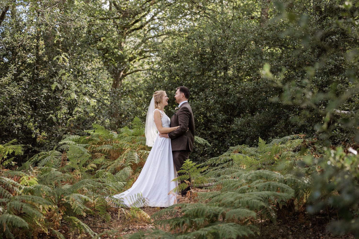 Wedding couple in ferns in Surrey
