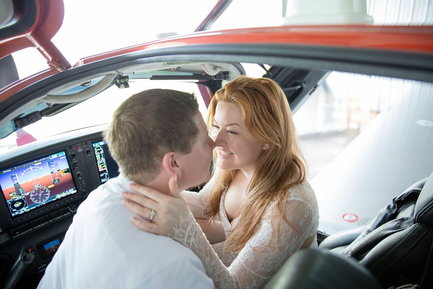 romantic beach engagement couple at Anna Maria Island with turquoise water sunrise Florida and private jet photoshoot at Sarasota airport