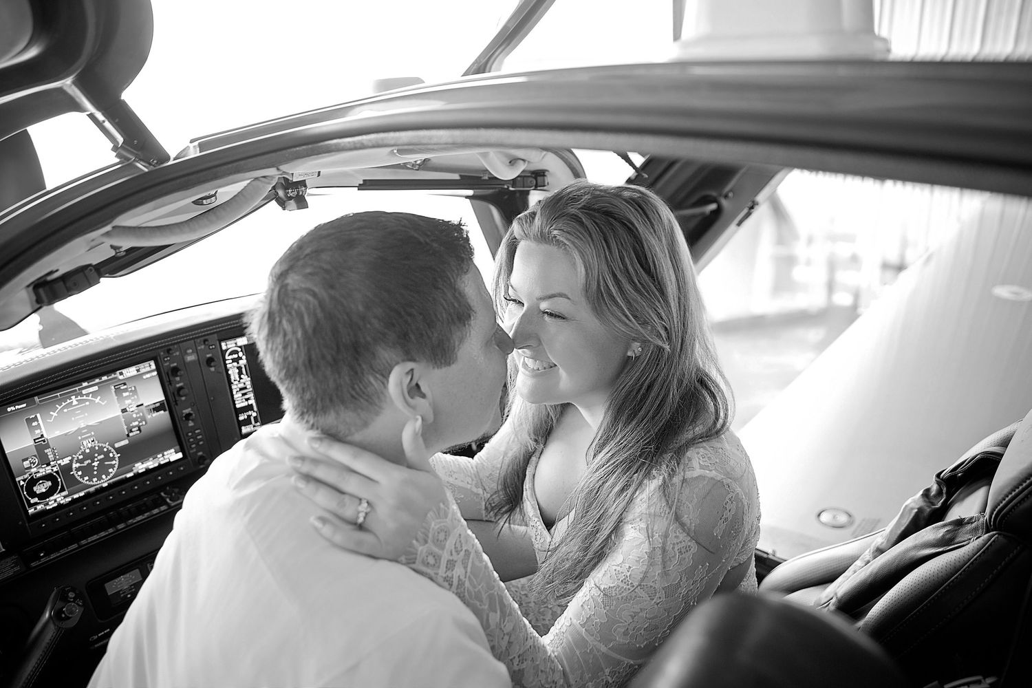 romantic beach engagement couple at Anna Maria Island with turquoise water sunrise Florida and private jet photoshoot at Sarasota airport