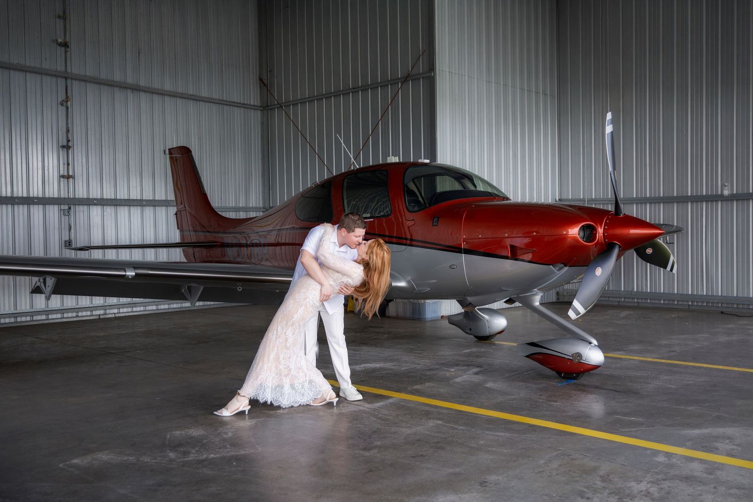 romantic beach engagement couple at Anna Maria Island with turquoise water sunrise Florida and private jet photoshoot at Sarasota airport