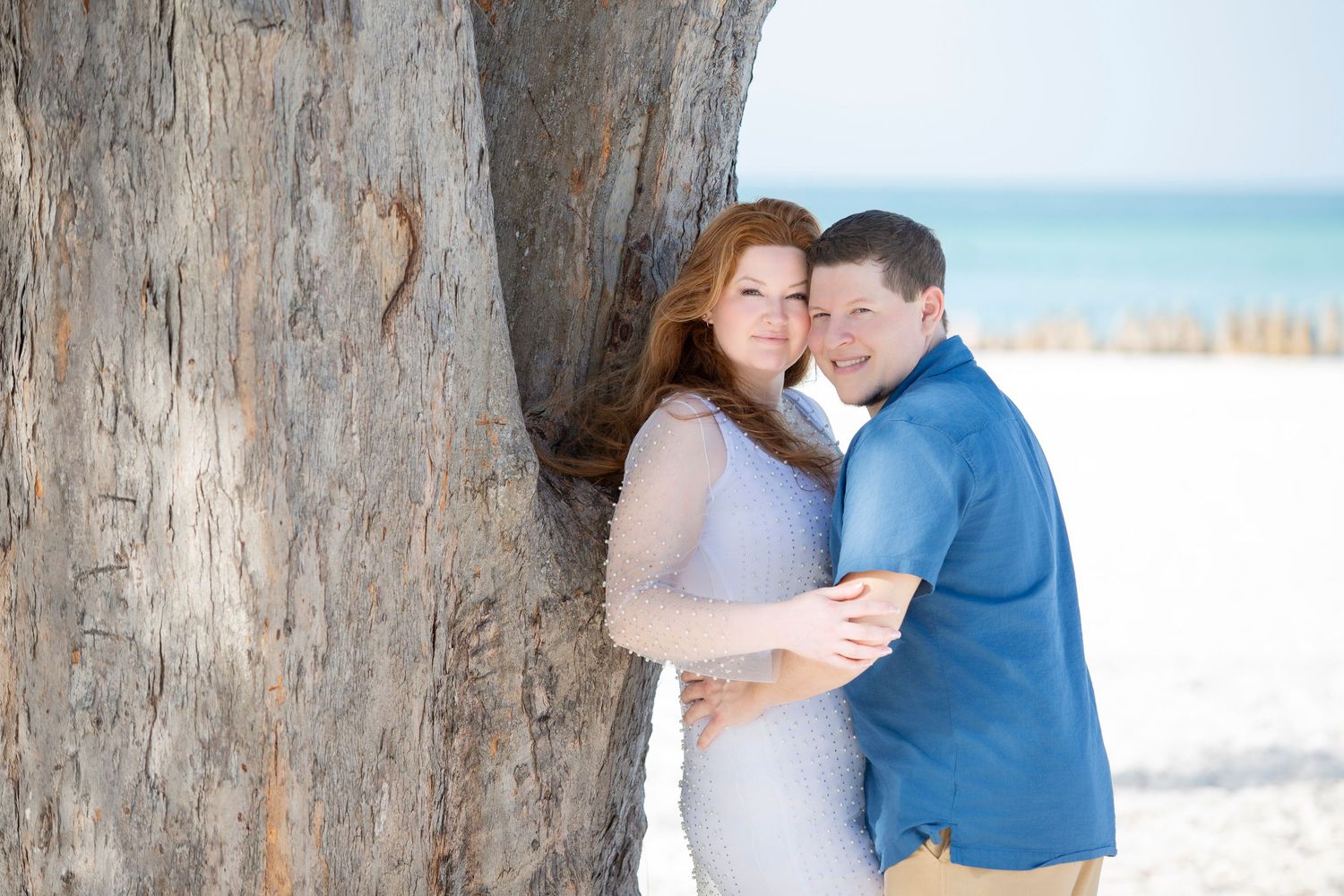 romantic beach engagement couple at Anna Maria Island with turquoise water sunrise Florida and private jet photoshoot at Sarasota airport