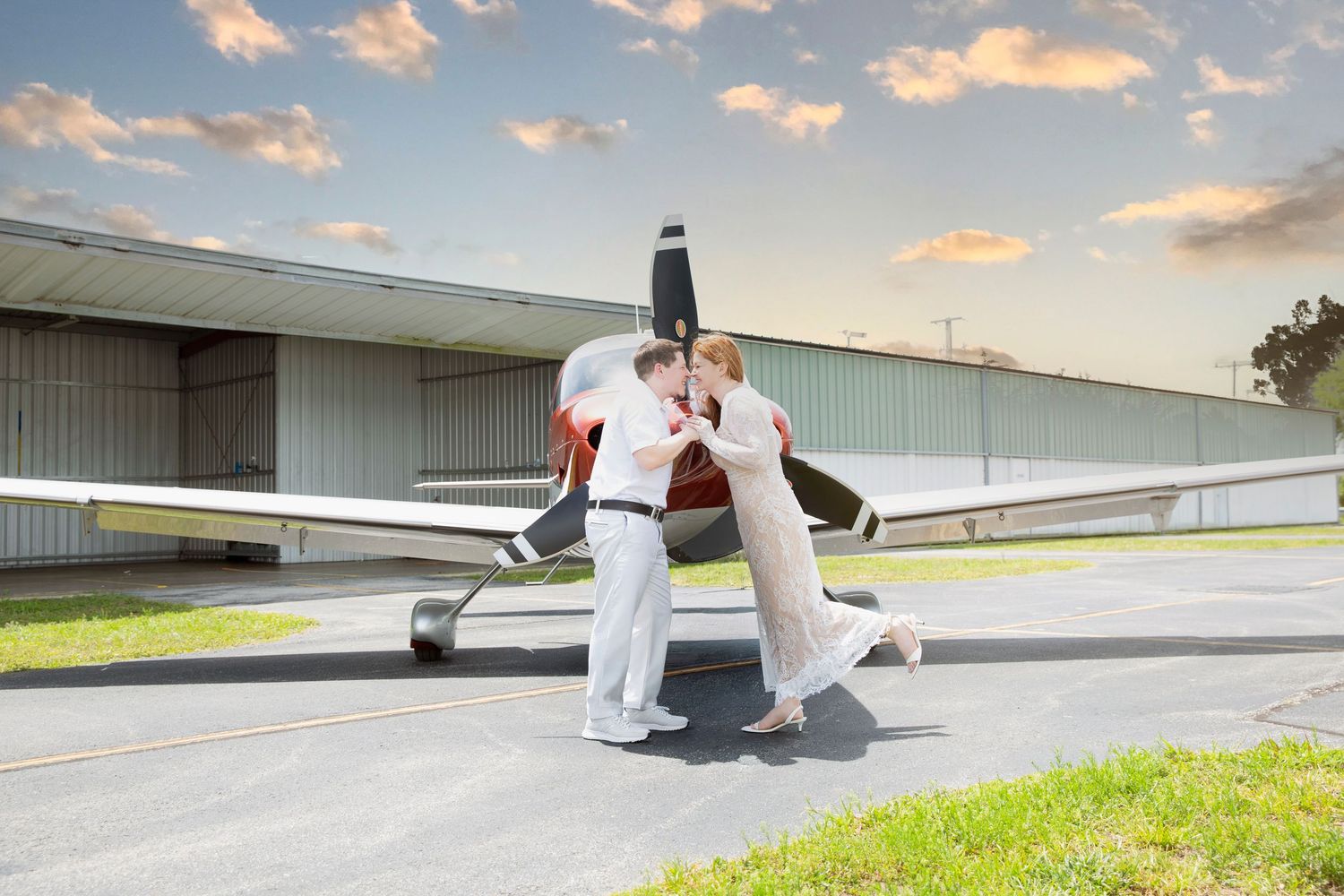 romantic beach engagement couple at Anna Maria Island with turquoise water sunrise Florida and private jet photoshoot at Sarasota airport