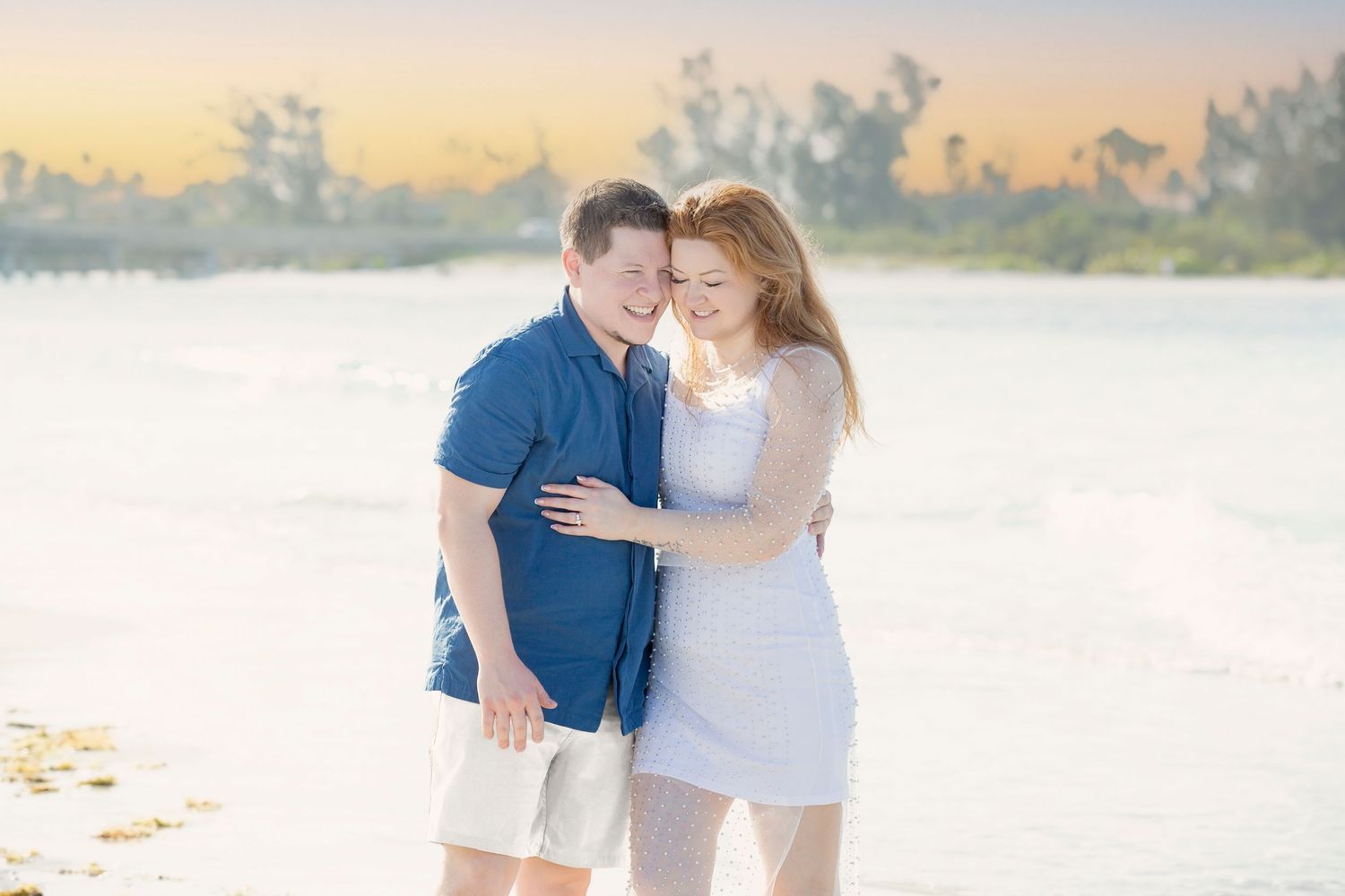 romantic beach engagement couple at Anna Maria Island with turquoise water sunrise Florida and private jet photoshoot at Sarasota airport