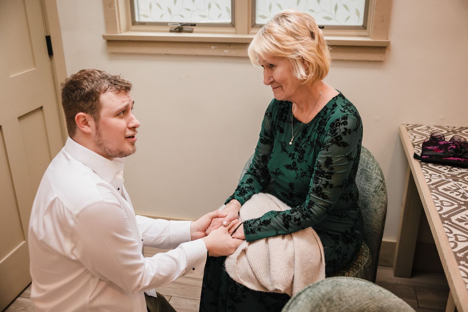 Emotional moment between groom and grandmother during getting ready at Briar Barn Inn wedding in Massachusetts