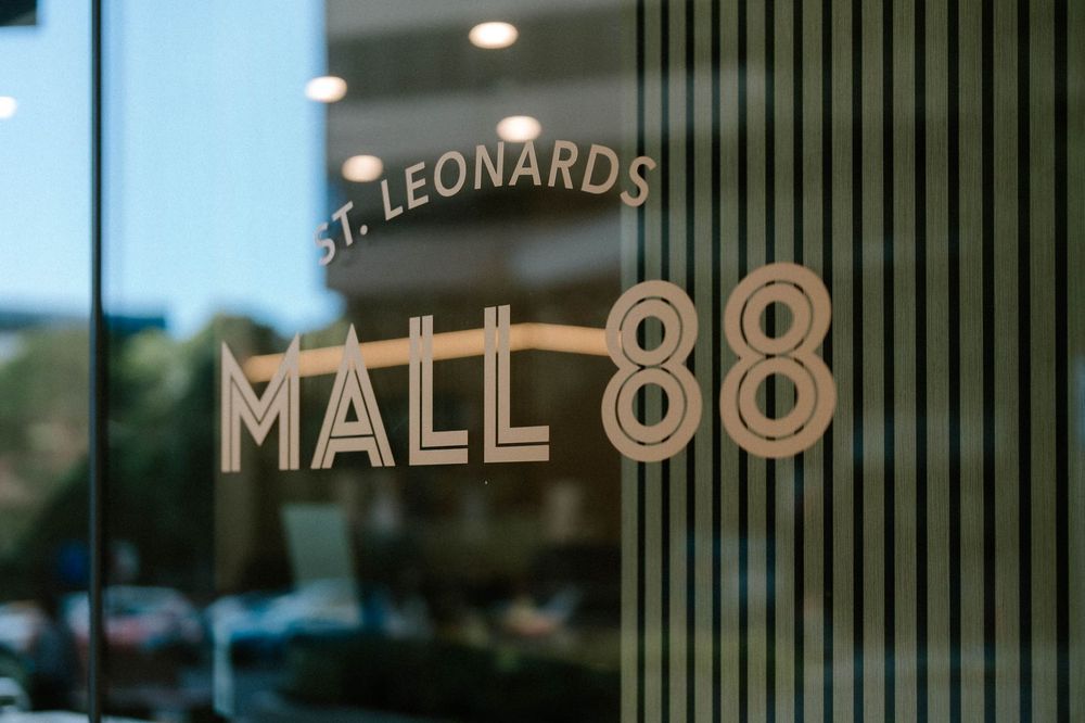 St. Leonards Mall 88 logo displayed on a modern glass building entrance in Sydney.