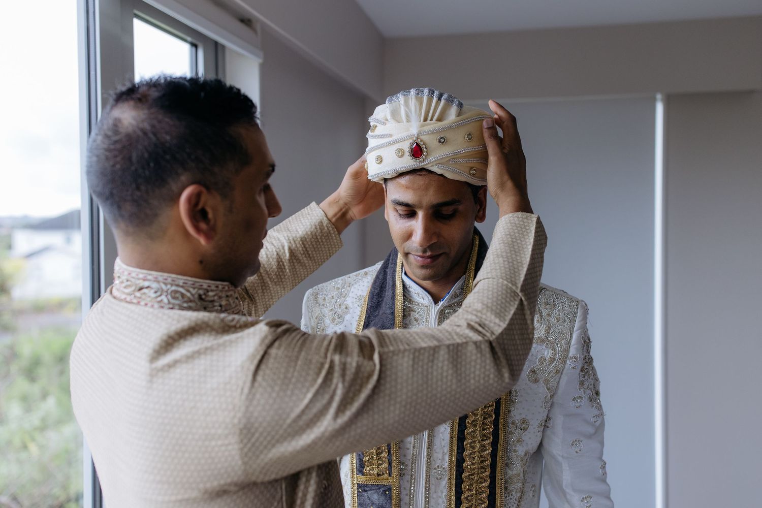 Indian groom getting ready before wedding ceremony