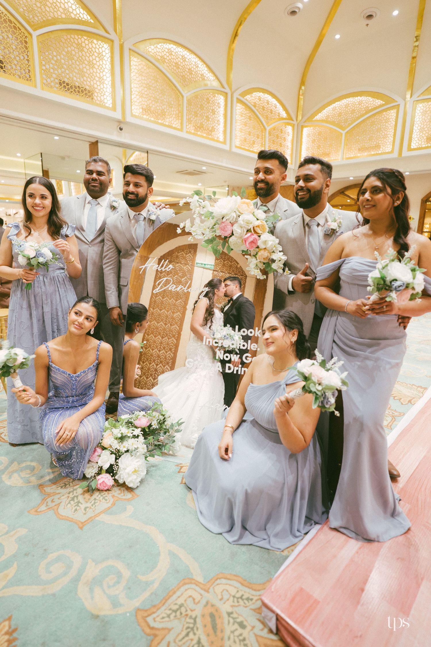 Wedding party in blue gowns & gray suits at an elegant ballroom top wedding photographer in Sydney, Gold Coast & Brisbane.
