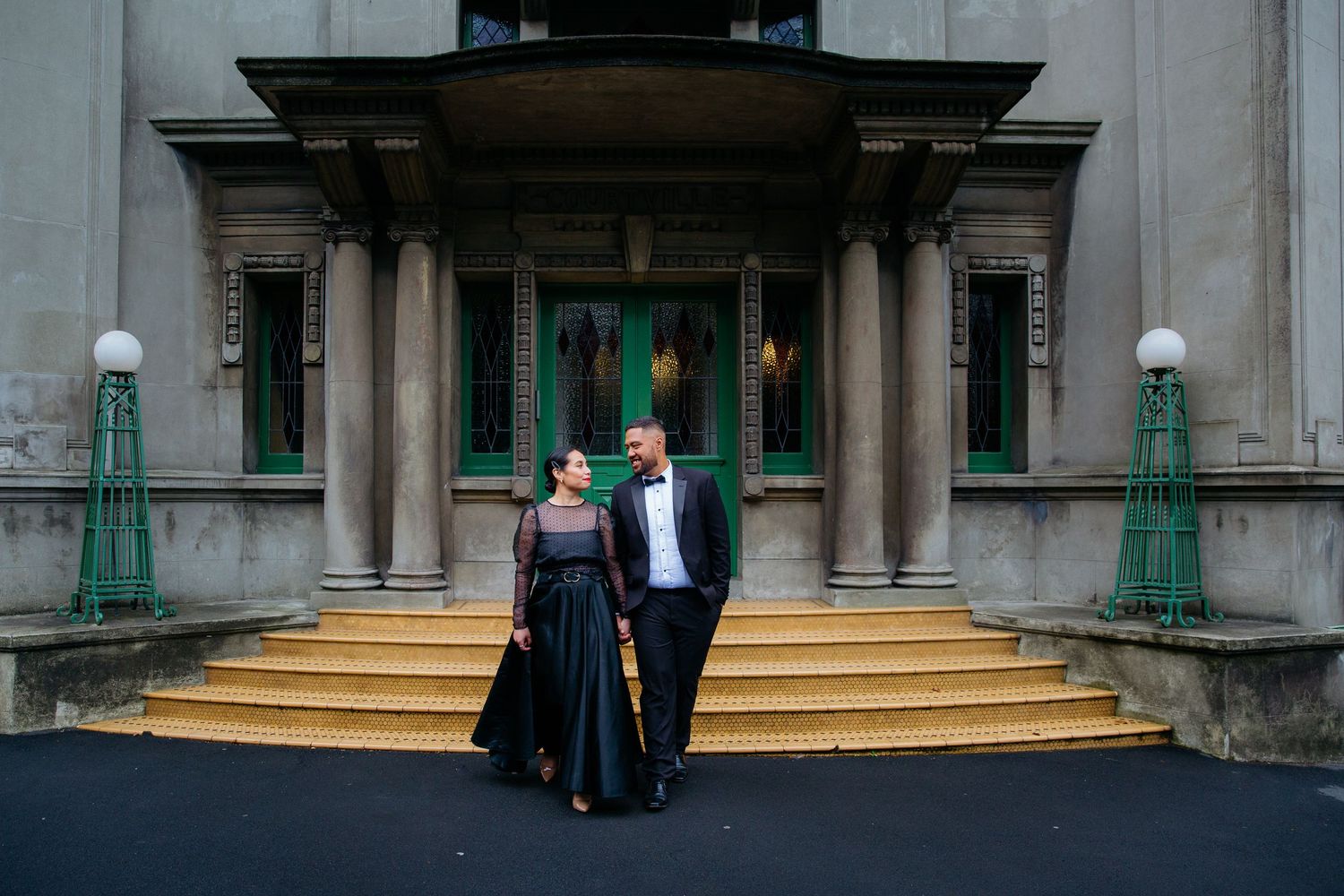 Couple walking through Auckland city during engagement shoot