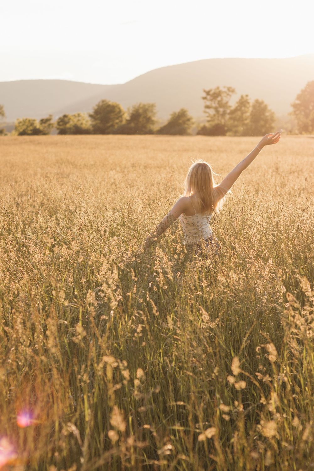 Frolicking in a wildflower field at golden hour sunset