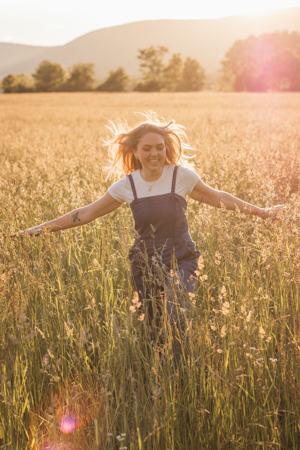 Frolicking in a wildflower field at golden hour sunset