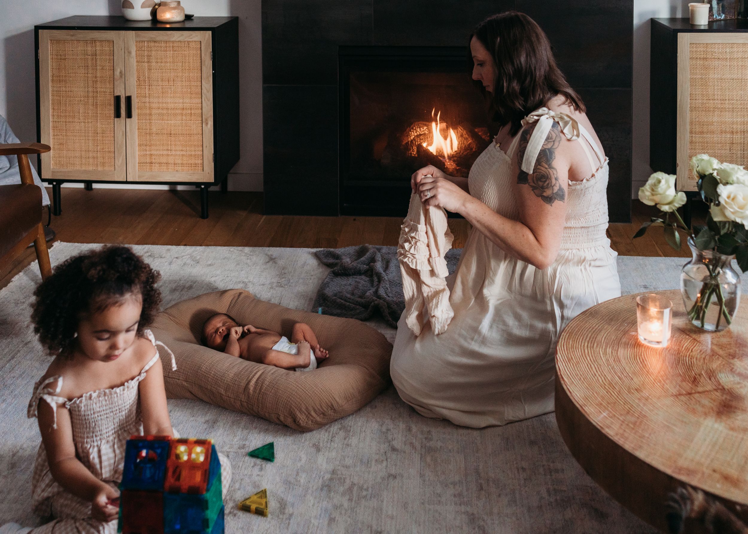 Family bonds over casual moments in a home, sharing tender interactions by candlelight and comfortable settings.