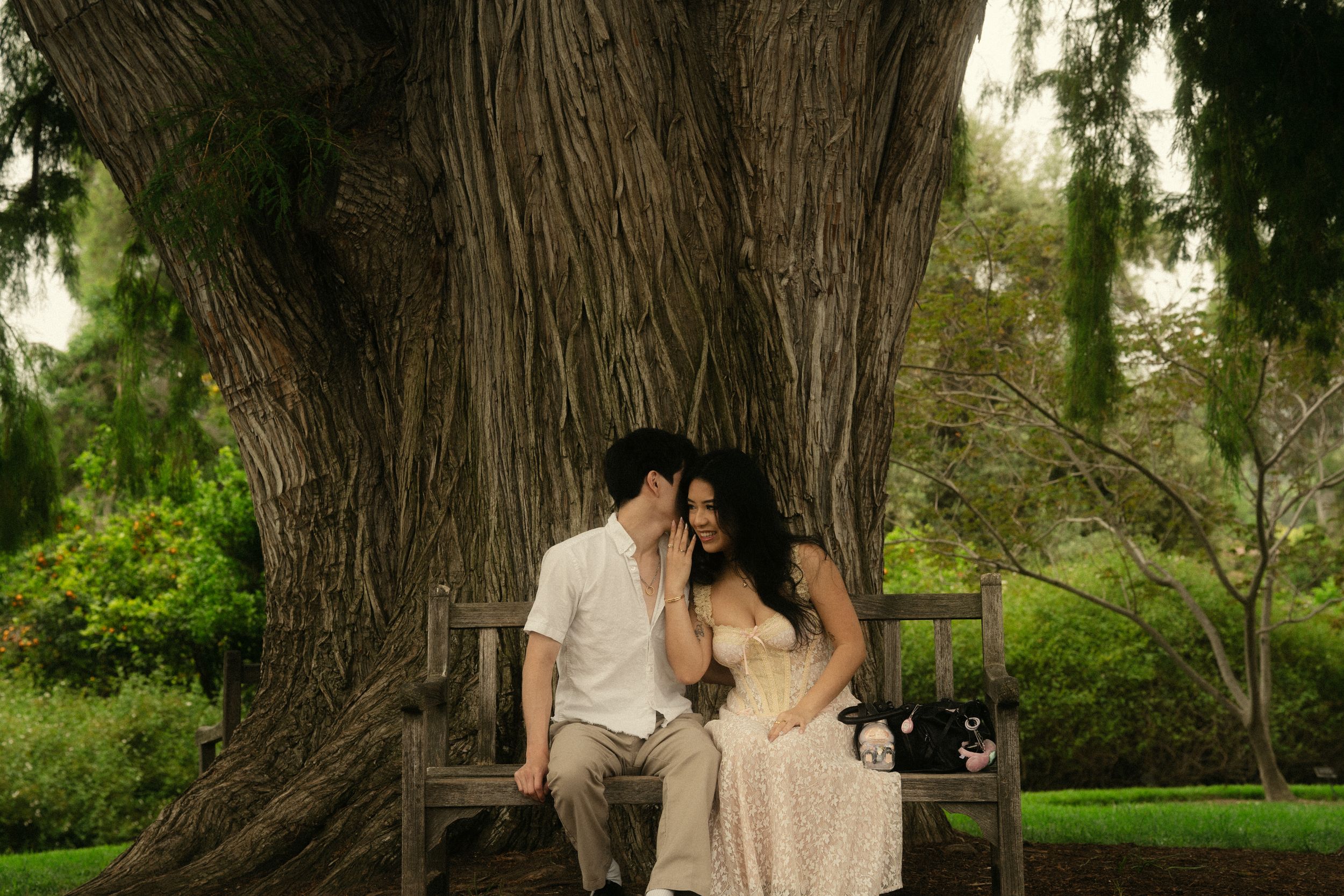 Couple standing together at The Huntington Library gardens in Pasadena during candid photoshoot
