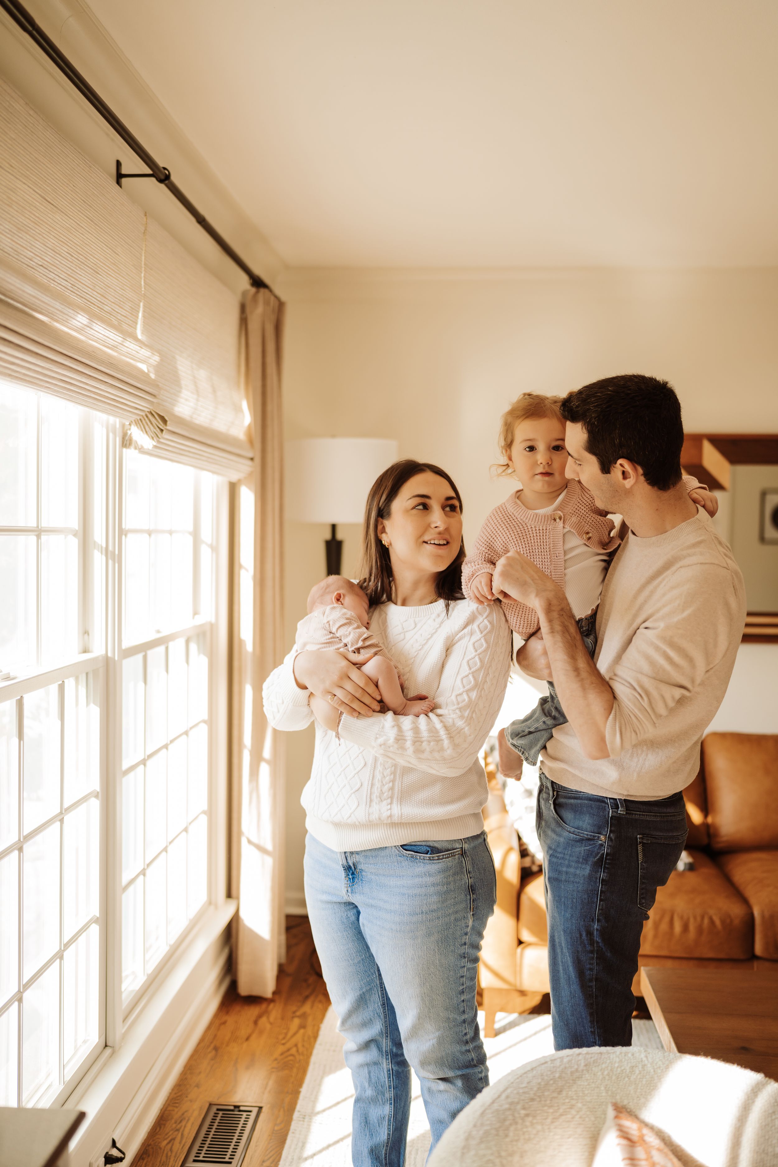 A series of intimate lifestyle photos showing tender moments between people embracing in a sunlit room.