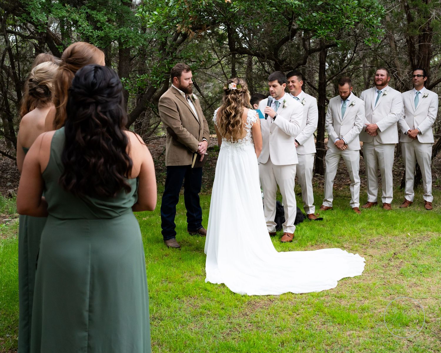 Wedding photo of groom sharing vows to bride
